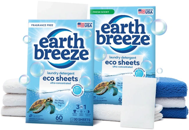 Earth Breeze laundry detergent sheet going into a washing machine