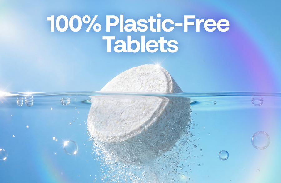 Unwrapped dishwasher tablet in water